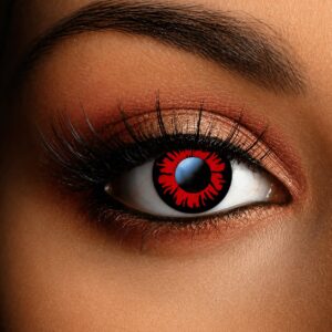 Close-up of an eye wearing Twilight Volturi Vampire Contact Lenses, featuring a vivid blood-red iris with a jagged black sunburst design for a striking vampire-inspired look.